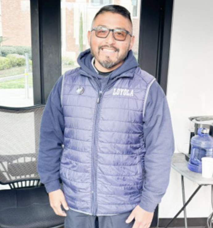 ELI HERNANDEZ POSES in the security office in Hayden Circle